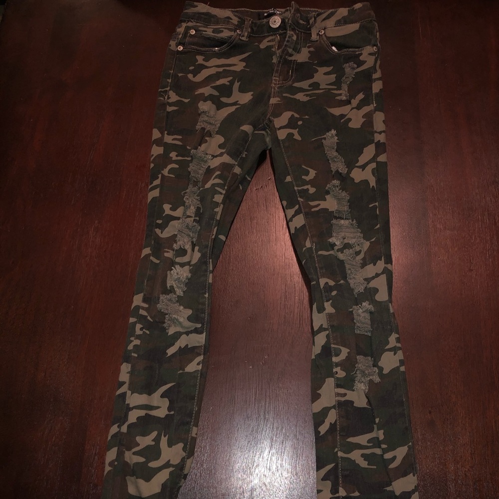 Distressed camo jeans